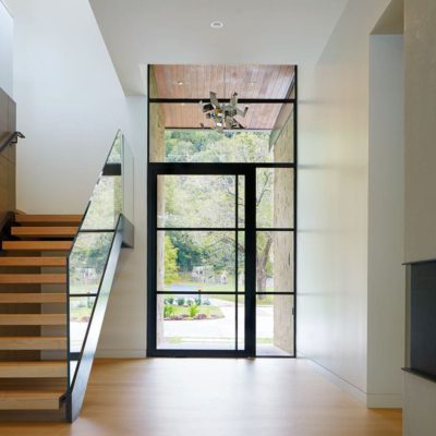 Glass and steel pivot entry with sidelites