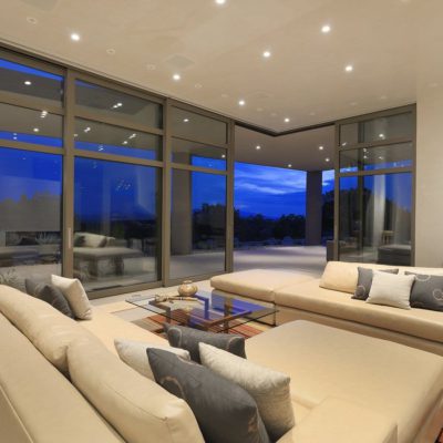 Massive aluminum sliding patio doors that meet in the corner, interior view Massive aluminum lift and slide doors that meet in the corner, interior view