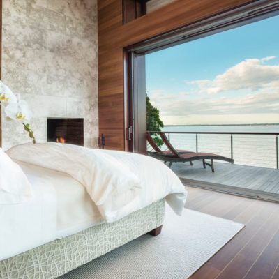Pocketing lift & slide doors overlooking the harbour from a bedroom Pocketing lift and slide doors overlooking the harbour from a bedroom