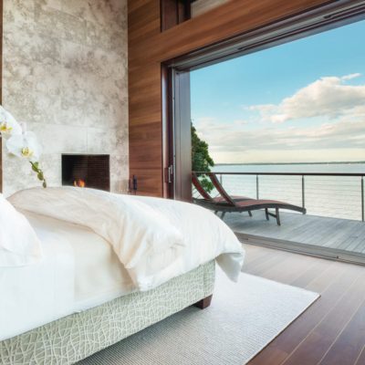 Pocketing lift and slide doors overlooking the harbour from a bedroom