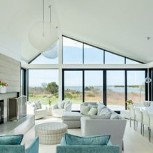 aluminum sliding patio doors in modern home by the water