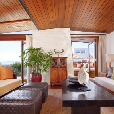 wood bifolding doors Wood bi-fold doors open to reveal a post-less corner view