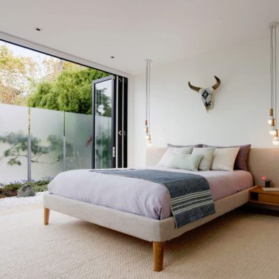 wood bifolds9 Wood bifold doors open bedroom to outdoors
