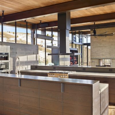 Modern kitchen with steel windows and mountain view in the background