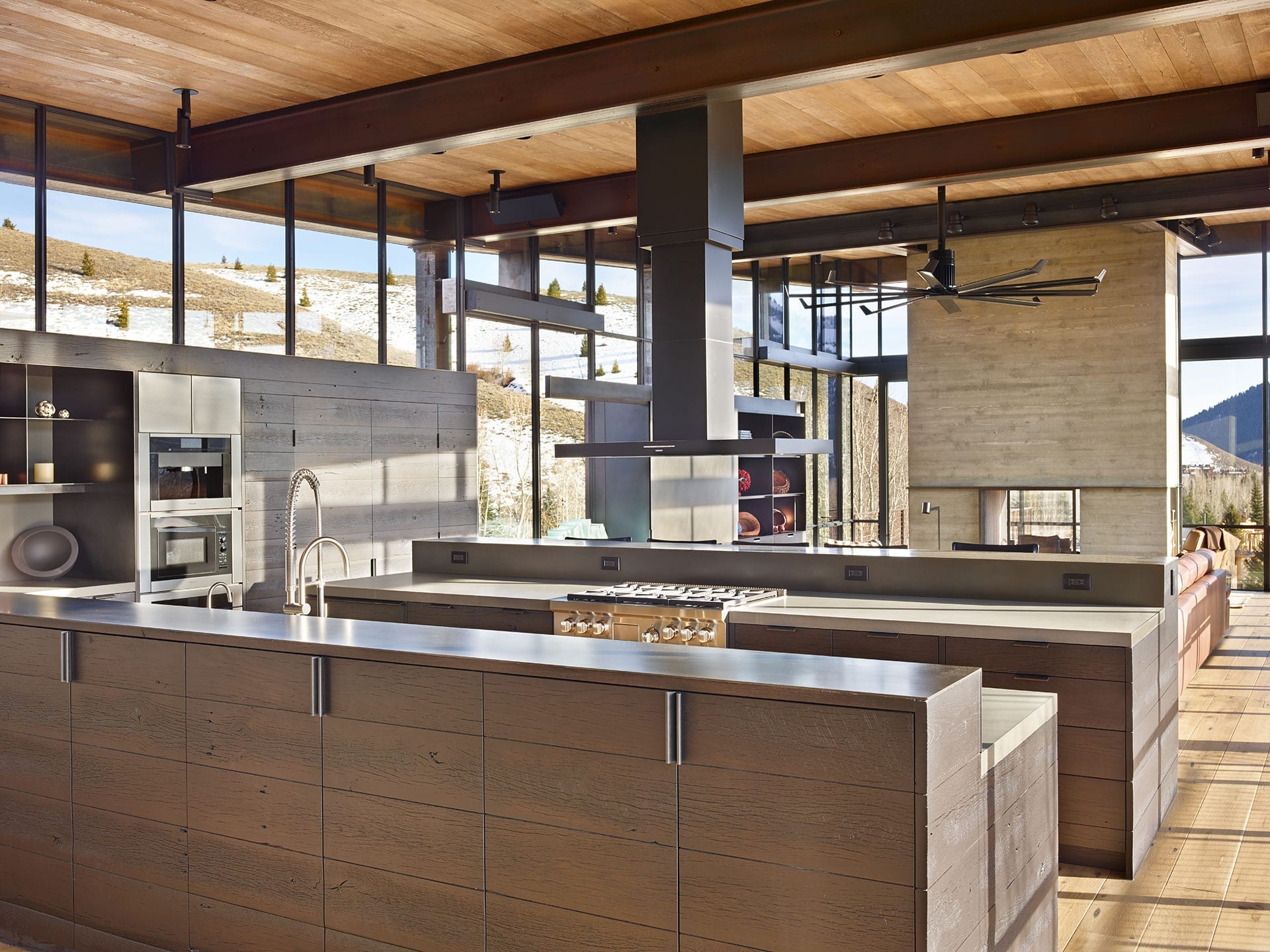 Modern kitchen with steel windows and mountain view in the background