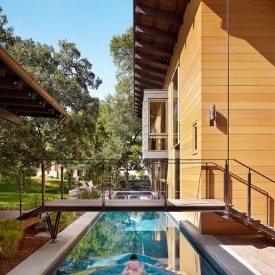 Lap pool with walkway and modern wood windows