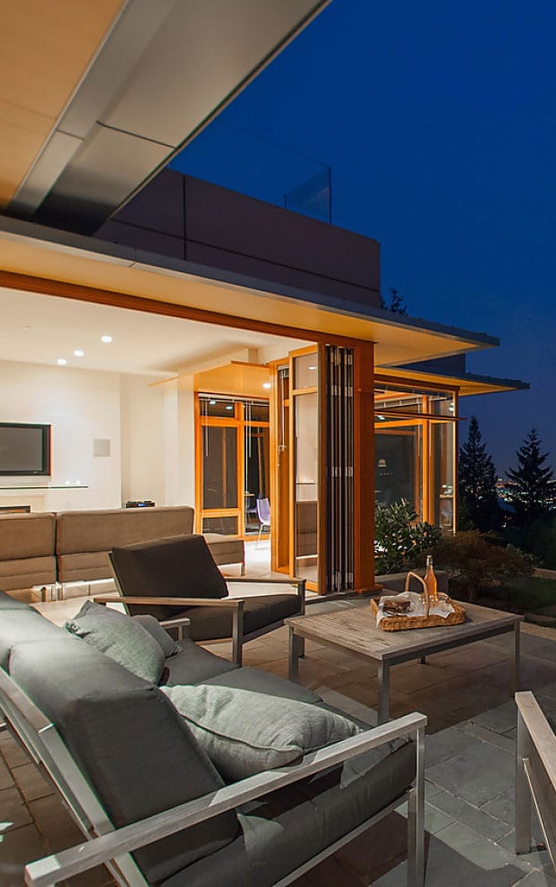 Exterior bifold doors Exterior bifold doors of wood and glass stacked open for optimal view