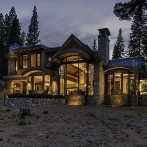 Modern wood windows viewed at night from outside a Lake Tahoe mountain home