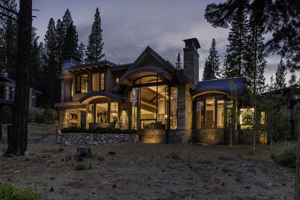 Modern wood windows viewed at night from outside a Lake Tahoe mountain home