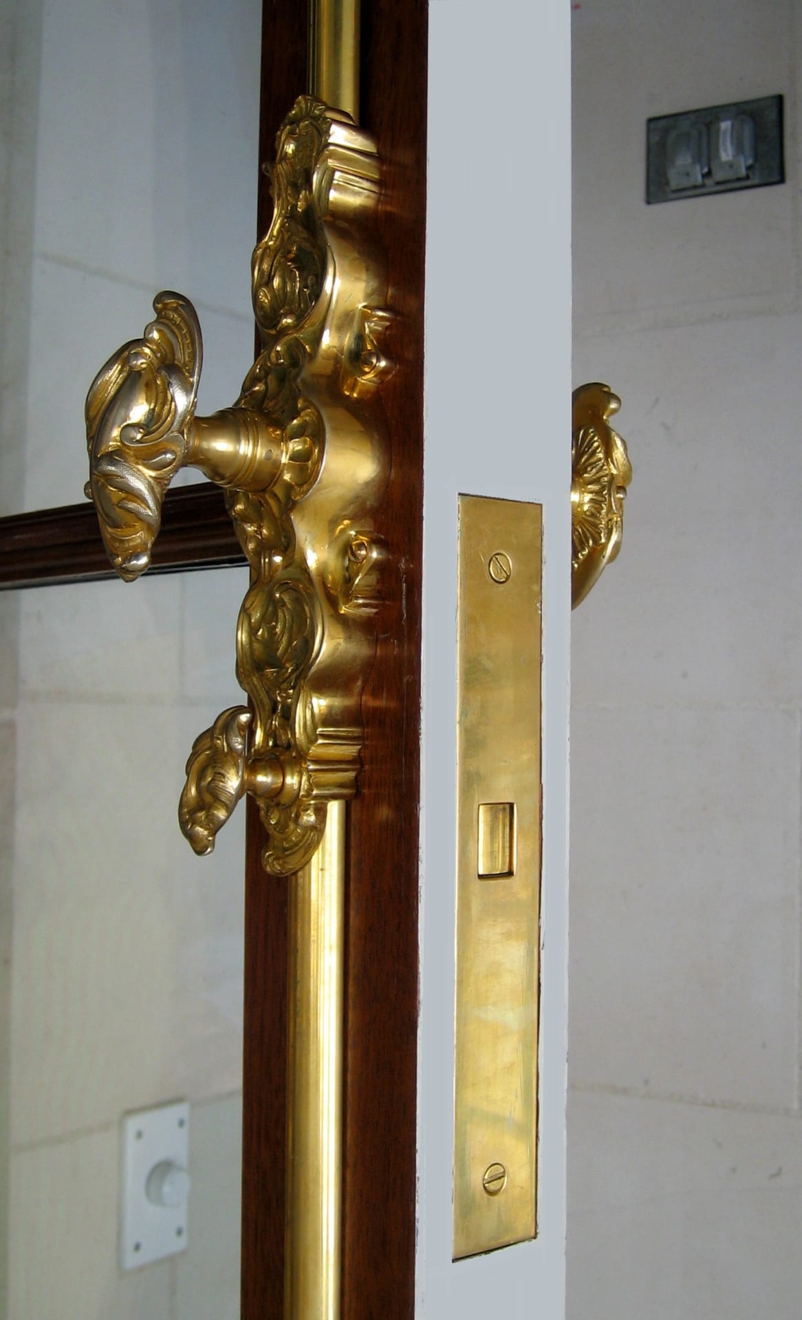 Ornate custom door handle hardware on traditional door