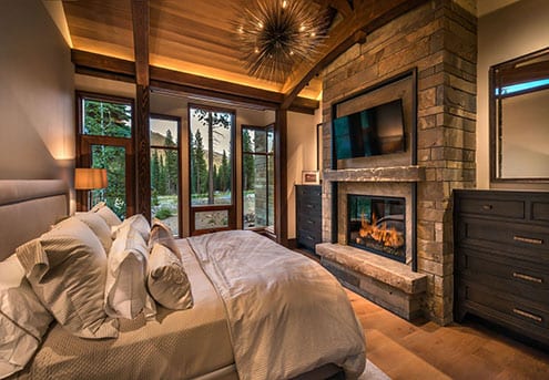 Modern custom wood windows in bedroom of mountain home