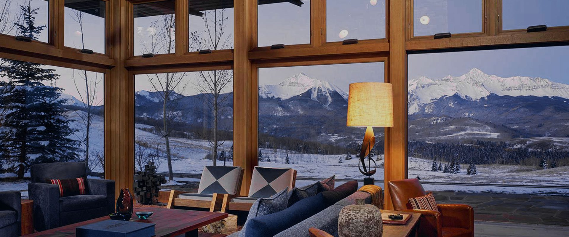 Looking through large custom wooden windows to reveal a beautiful mountain landscape. Looking through large custom wooden windows to reveal a beautiful mountain landscape.