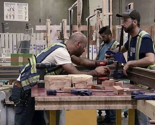 View of workers in metal window shop