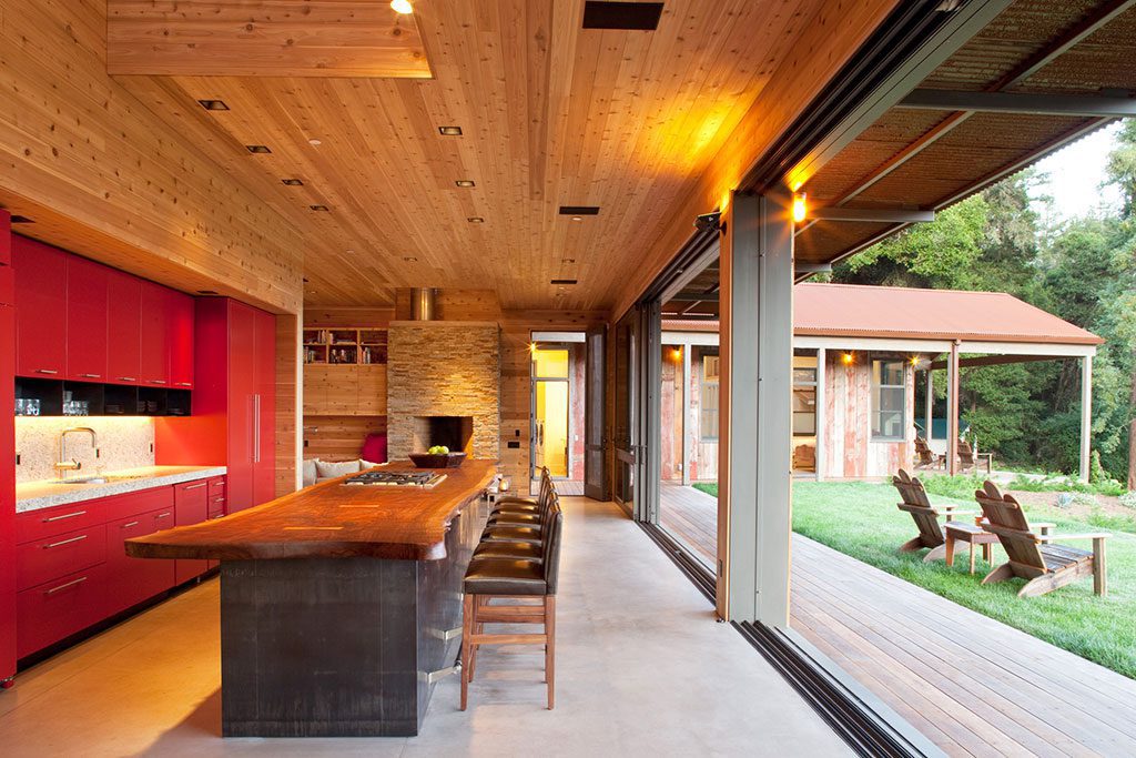 Modern farmhouse interior with massive lift and slide doors