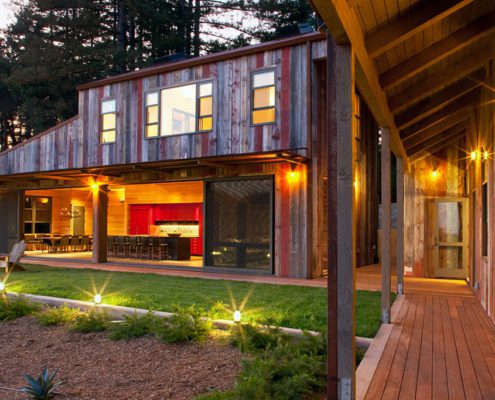 Modern rustic farmhouse at night