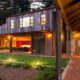 Modern rustic farmhouse at night