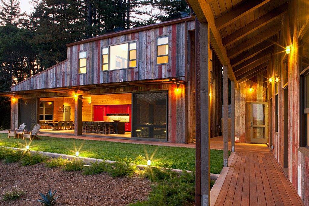 Modern rustic farmhouse at night