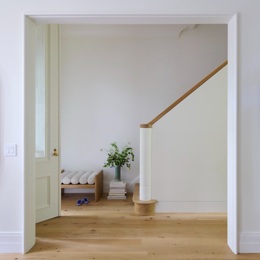 Entryway and stairwell viewed from adjoining room